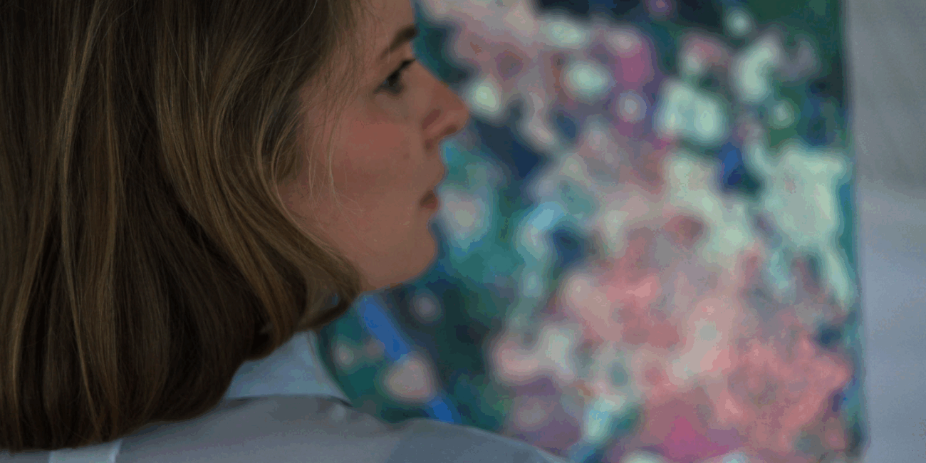 Artist Karolina Howorko mixing acrylics in her studio space